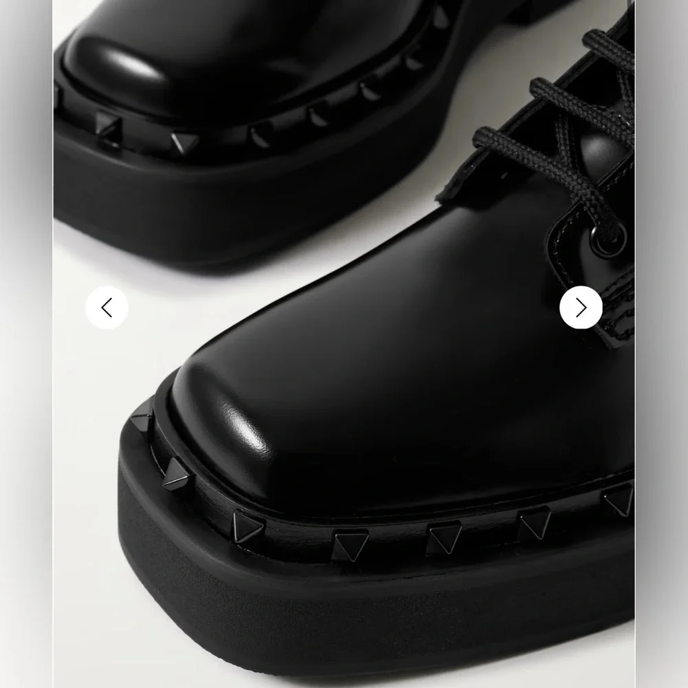 Valentino Garavani - Rockstud embellished glossed-leather ankle combat boots